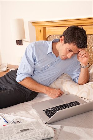 simsearch:600-03849655,k - Man using Laptop in Hotel Room, Reef Playacar Resort and Spa, Playa del Carmen, Mexico Stock Photo - Premium Royalty-Free, Code: 600-03849177