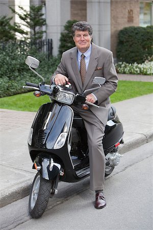Businessman on Scooter, Montreal, Quebec, Canada Stock Photo - Premium Royalty-Free, Code: 600-03849291