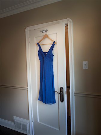 Dress Hanging on Closet Door Stock Photo - Premium Royalty-Free, Code: 600-03849756