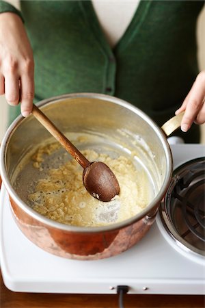 simsearch:695-05770947,k - Woman Stirring Roux in Pot Stock Photo - Premium Royalty-Free, Code: 600-03849752