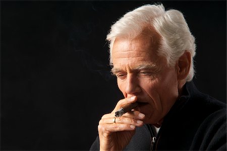 Man Smoking Cigar Stock Photo - Premium Royalty-Free, Code: 600-03865039