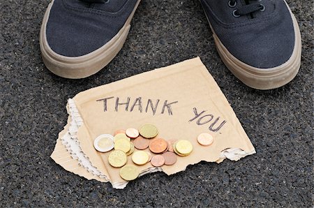 Feet with Spare Change and Thank You Sign Foto de stock - Royalty Free Premium, Número: 600-03865113