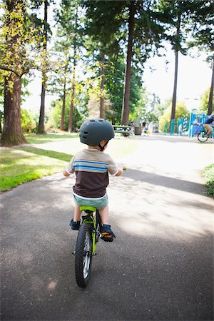 people balancing bicycle picture - Boy Riding Bicycle, Washington Park, Portland, Oregon, USA Stock Photo - Premium Royalty-Free, Code: 600-03865195