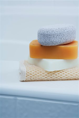 Soaps and Pumice Stone on edge of Tub Stock Photo - Premium Royalty-Free, Code: 600-03891286