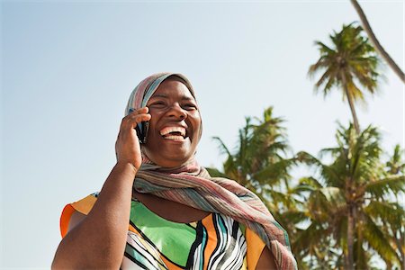 smartphone at beach - Woman Using Cell Phone, Nyota Beach, Unguja, Zanzibar, Tanzania Stock Photo - Premium Royalty-Free, Code: 600-03907373