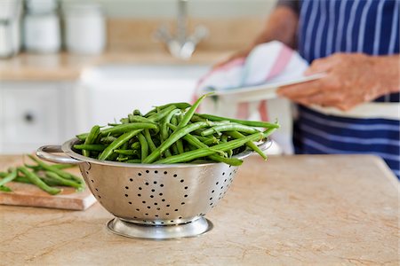 Man Cooking with Vegetables in Kitchen, Cape Town, Western Cape, South Africa Stock Photo - Premium Royalty-Free, Code: 600-03907383