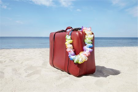 Lei on Suitcase, Rosenhagen, Baltic Sea, Mecklenburg-Vorpommern, Germany Stock Photo - Premium Royalty-Free, Code: 600-03907399