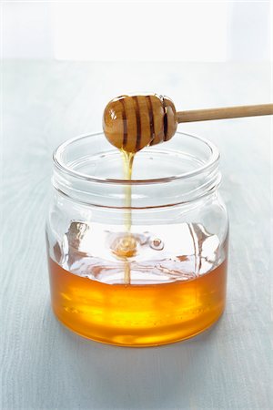 Honey Dipper in Jar Foto de stock - Sin royalties Premium, Código: 600-03907436