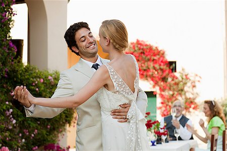 Newlyweds dancing at wedding reception Stock Photo - Premium Royalty-Free, Code: 614-05399364