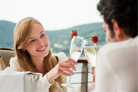 Young couple toasting with champagne Stock Photo - Premium Royalty-Free, Code: 614-05399502