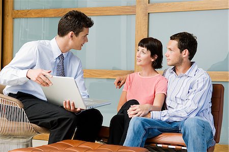 financial advisor and couple - Couple meeting financial advisor Stock Photo - Premium Royalty-Free, Code: 614-05399683