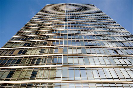 Glass skyscrapers against blue sky Stock Photo - Premium Royalty-Free, Code: 614-05523120