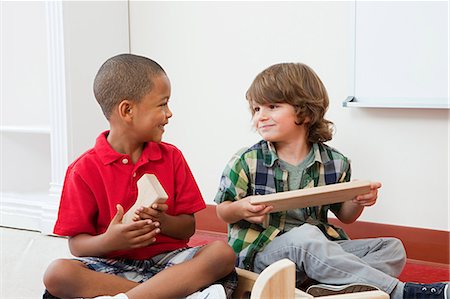 Two boys with building blocks Stock Photo - Premium Royalty-Free, Code: 614-05523134