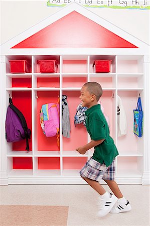 Boy running in school Stock Photo - Premium Royalty-Free, Code: 614-05523145