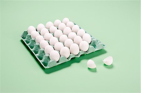 escape - Broken egg next to egg carton Stock Photo - Premium Royalty-Free, Code: 614-05556929