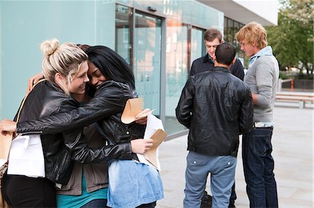 diversity in college campuses - University students embracing on exam results day Stock Photo - Premium Royalty-Free, Code: 614-05557339