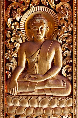 simsearch:6122-07697607,k - Golden Buddha relief at Luang Prabang, Laos Foto de stock - Sin royalties Premium, Código: 614-05557378