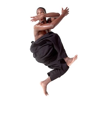 schwarz - Tänzerin in der Mitte Luft-pose Stockbilder - Premium RF Lizenzfrei, Bildnummer: 614-05650897