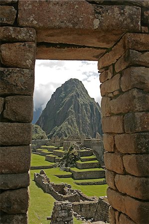 View of Machu Picchu through stone wall Stock Photo - Premium Royalty-Free, Code: 614-05792123