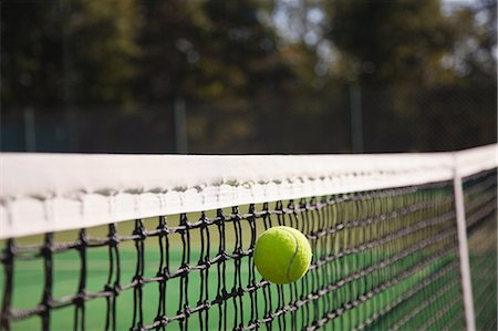 Tennis ball hitting net Stock Photo - Premium Royalty-Free, Code: 614-05792197