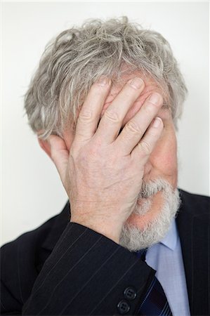 people hiding their face - Senior man with hand covering face Stock Photo - Premium Royalty-Free, Code: 614-05792322