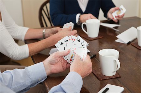simsearch:6122-07697873,k - People playing cards Stock Photo - Premium Royalty-Free, Code: 614-05792346