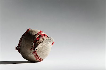 sports and baseball - Worn baseball with broken stitching Stock Photo - Premium Royalty-Free, Code: 614-05792433