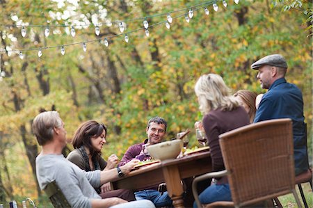 dinner outside adults - Friends at outdoor dinner Stock Photo - Premium Royalty-Free, Code: 614-05792562