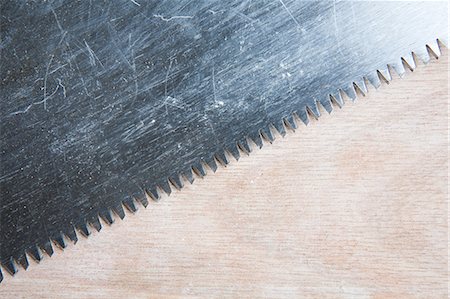 saw - Close up on saw and wood Stock Photo - Premium Royalty-Free, Code: 614-05819013