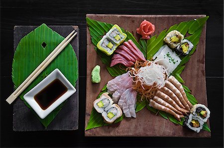 food on black - Dish of sashimi and sushi rolls Stock Photo - Premium Royalty-Free, Code: 614-05819084