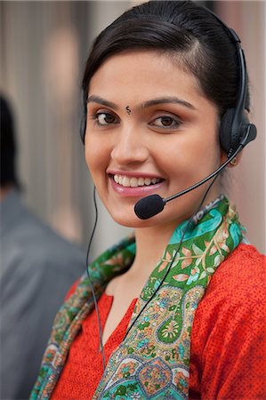 Portrait of a female call center agent Stock Photo - Premium Royalty-Free, Code: 614-05955218