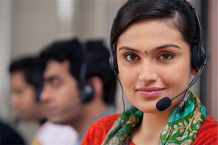 Portrait of a female call center agent Stock Photo - Premium Royalty-Free, Code: 614-05955219