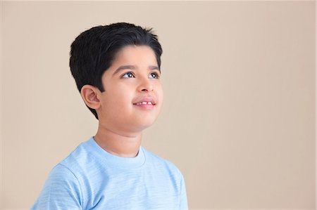 Young boy looking up Stock Photo - Premium Royalty-Free, Code: 614-05955350