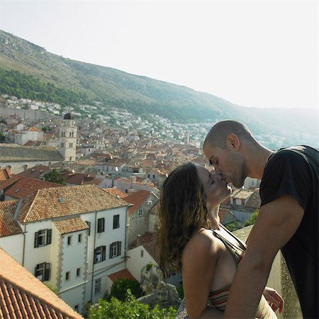 simsearch:614-05955572,k - Young couple kissing above city of Dubrovnik, Croatia Stock Photo - Premium Royalty-Free, Code: 614-05955573