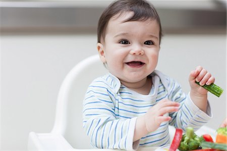 Baby boy eating healthy vegetables Stock Photo - Premium Royalty-Free, Code: 614-05955617