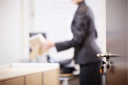 frame white - Businesswoman in new office, focus on foreground Stock Photo - Premium Royalty-Free, Code: 614-05955715