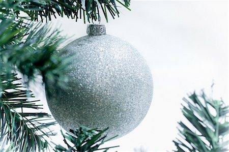 simsearch:614-05955756,k - Silver christmas bauble on tree Stock Photo - Premium Royalty-Free, Code: 614-05955758