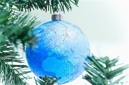 Globe bauble on christmas tree Stock Photo - Premium Royalty-Free, Code: 614-05955800