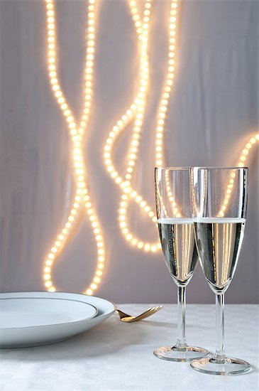 Glasses of champagne on table at an event Stock Photo - Premium Royalty-Free, Image code: 614-06002044