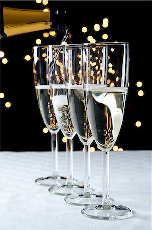 pouring champagne - Pouring glasses of champagne Stock Photo - Premium Royalty-Free, Code: 614-06002083