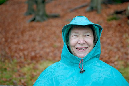senior portrait expression - Senior woman wearing waterproof clothing and smiling Stock Photo - Premium Royalty-Free, Code: 614-06002122