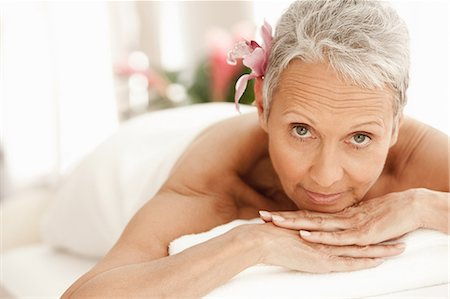 simsearch:614-06537326,k - Senior woman relaxing on massage table, portrait Stock Photo - Premium Royalty-Free, Code: 614-06002275