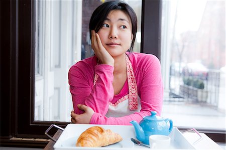 pastries woman cafe - Female cafe owner thinking over breakfast Stock Photo - Premium Royalty-Free, Code: 614-06002321