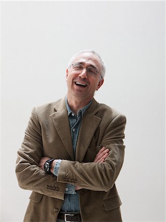 fun people on white background - Mature man laughing, studio shot Stock Photo - Premium Royalty-Free, Code: 614-06002434