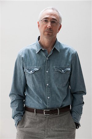 eyeglasses white background - Portrait of mature man, studio shot Stock Photo - Premium Royalty-Free, Code: 614-06002437