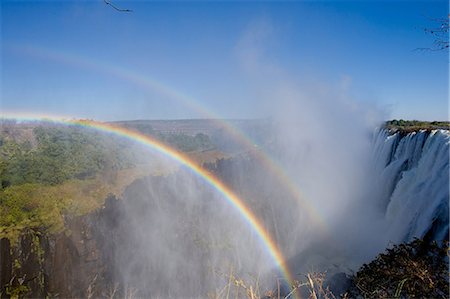 rainbow landscape not person - Rainbows over Victoria Falls Stock Photo - Premium Royalty-Free, Code: 614-06002551