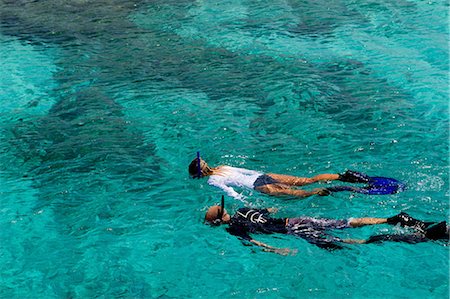 swim - Snorkelers in the Caribbean Sea Stock Photo - Premium Royalty-Free, Code: 614-06002561