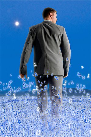 future technology - Businessman walking through binary field Foto de stock - Sin royalties Premium, Código: 614-06044009