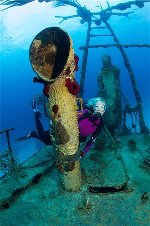 scuba-diving - Scuba Diver on Shipwreck Stock Photo - Premium Royalty-Free, Code: 614-06044268