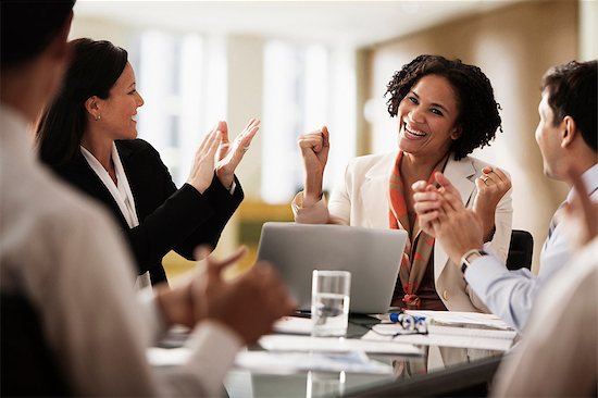 Business colleagues applauding in office Stock Photo - Premium Royalty-Free, Image code: 614-06044381